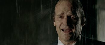 Movie still from “Bad Education” (2004), directed by Pedro Almodóvar – A person in a suit and tie; Extreme Close Up shot, Low angle