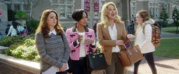 Movie still from “Bad Moms” (2016), directed by Scott Moore – A group of women standing next to each other on a sidewalk; Medium shot, High angle