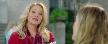 Movie still from “Bad Moms” (2016), directed by Scott Moore – A woman in a red shirt is talking to a man; Close Up shot, Over the shoulder angle