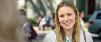 Movie still from “Bad Moms” (2016), directed by Scott Moore – A person smiling for the camera; Close Up shot, Over the shoulder angle