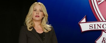 Movie still from “Bad Moms” (2016), directed by Scott Moore – A woman with long blonde hair wearing a black jacket; Close Up shot, Low angle