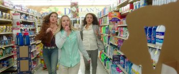 Movie still from “Bad Moms” (2016), directed by Scott Moore – A group of women walking down a aisle in a store; Wide shot, Low angle