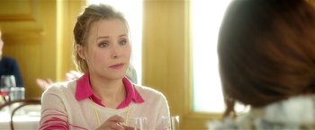 Movie still from “Bad Moms” (2016), directed by Scott Moore – A woman sitting at a table with a glass of wine in front of her; Close Up shot, Over the shoulder angle