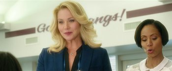 Movie still from “Bad Moms” (2016), directed by Scott Moore – A woman with blonde hair wearing a blue jacket; Close Up shot, Low angle