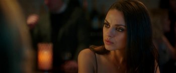 A beautiful woman sitting in front of a mirror