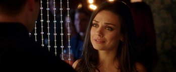 Movie still from “Bad Moms” (2016), directed by Scott Moore – A beautiful young lady looking at the camera; Close Up shot, Over the shoulder angle