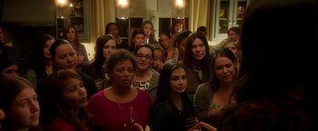 Movie still from “Bad Moms” (2016), directed by Scott Moore – A group of women standing next to each other holding wine glasses; Medium shot, High angle