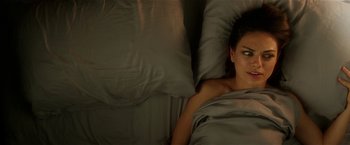 Movie still from “Bad Moms” (2016), directed by Scott Moore – A woman laying in a bed under a blanket; Close Up shot, Overhead angle
