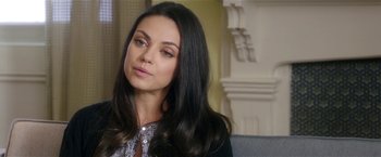 Movie still from “Bad Moms” (2016), directed by Scott Moore – A woman with long black hair sitting on top of a couch; Close Up shot, Over the shoulder angle