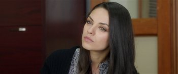 Movie still from “Bad Moms” (2016), directed by Scott Moore – A woman with long black hair looking to her left; Close Up shot, Over the shoulder angle