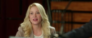 Movie still from “Bad Moms” (2016), directed by Scott Moore – A woman with blonde hair and a white shirt; Close Up shot, Over the shoulder angle