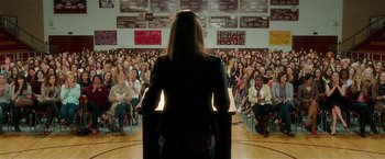 Movie still from “Bad Moms” (2016), directed by Scott Moore – A woman is giving a speech to a crowd of people; Wide shot, High angle