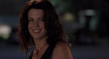 Movie still from “Bad Santa” (2003), directed by Terry Zwigoff – A person wearing a necklace; Close Up shot, Over the shoulder angle