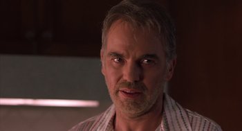 Movie still from “Bad Santa” (2003), directed by Terry Zwigoff – A person wearing a shirt; Close Up shot, Low angle