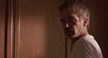 Movie still from “Bad Santa” (2003), directed by Terry Zwigoff – A person in a room; Close Up shot, Low angle