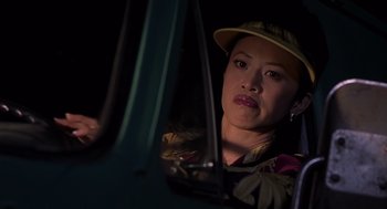 Movie still from “Bad Santa” (2003), directed by Terry Zwigoff – A woman sitting in the driver's seat of a car; Close Up shot, Over the shoulder angle