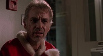 Movie still from “Bad Santa” (2003), directed by Terry Zwigoff – A person wearing a santa suit; Close Up shot, Low angle