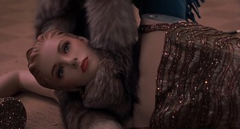 Movie still from “Bad Santa” (2003), directed by Terry Zwigoff – A woman wearing a fur coat and a sequined dress; Close Up shot, Overhead angle