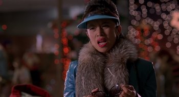 Movie still from “Bad Santa” (2003), directed by Terry Zwigoff – A woman wearing a hat and a fur coat; Close Up shot, Over the shoulder angle