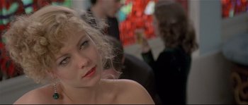 Movie still from “Bad Timing: A Sensual Obsession” (1980), directed by Nicolas Roeg – A person sitting in front of other people; Close Up shot, Over the shoulder angle