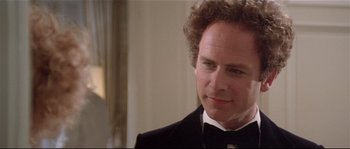 Movie still from “Bad Timing: A Sensual Obsession” (1980), directed by Nicolas Roeg – A person wearing a suit and tie; Close Up shot, Over the shoulder angle