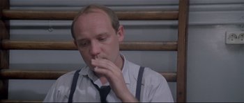 Movie still from “Bad Timing: A Sensual Obsession” (1980), directed by Nicolas Roeg – A man in a white dress shirt and black neck tie; Close Up shot, Low angle