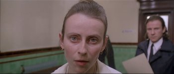 Movie still from “Bad Timing: A Sensual Obsession” (1980), directed by Nicolas Roeg – A person wearing a white shirt; Close Up shot, Over the shoulder angle