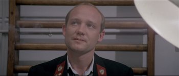 Movie still from “Bad Timing: A Sensual Obsession” (1980), directed by Nicolas Roeg – A person wearing a uniform; Close Up shot, Low angle