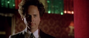 Movie still from “Bad Timing: A Sensual Obsession” (1980), directed by Nicolas Roeg – A person wearing a suit and tie; Close Up shot, Low angle