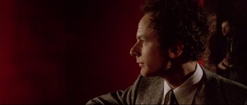 Movie still from “Bad Timing: A Sensual Obsession” (1980), directed by Nicolas Roeg – A person wearing a suit and tie; Close Up shot, Low angle