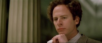 Movie still from “Bad Timing: A Sensual Obsession” (1980), directed by Nicolas Roeg – A person with curly brown hair; Close Up shot, Low angle