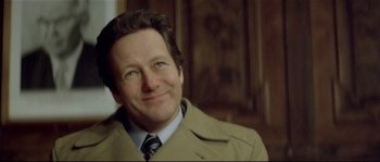 Movie still from “Bad Timing: A Sensual Obsession” (1980), directed by Nicolas Roeg – A person wearing a suit and tie; Close Up shot, Low angle