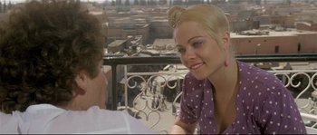 Movie still from “Bad Timing: A Sensual Obsession” (1980), directed by Nicolas Roeg – A woman sitting next to a man on top of a balcony; Close Up shot, Over the shoulder angle