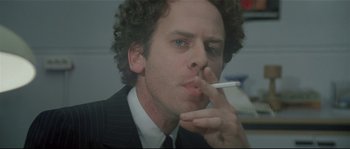 Movie still from “Bad Timing: A Sensual Obsession” (1980), directed by Nicolas Roeg – A person smoking a cigarette; Close Up shot, Low angle