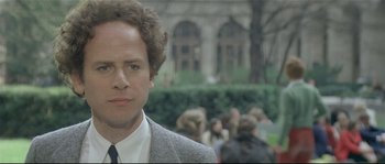 Movie still from “Bad Timing: A Sensual Obsession” (1980), directed by Nicolas Roeg – A person wearing a suit and a tie; Close Up shot, Over the shoulder angle