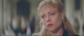Movie still from “Bad Timing: A Sensual Obsession” (1980), directed by Nicolas Roeg – A person with blonde hair; Close Up shot, Over the shoulder angle
