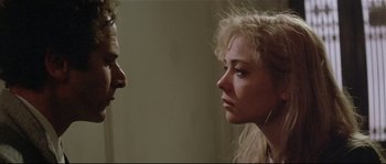 Movie still from “Bad Timing: A Sensual Obsession” (1980), directed by Nicolas Roeg – A woman and a man face to face in a room; Close Up shot, Over the shoulder angle