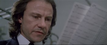 Movie still from “Bad Timing: A Sensual Obsession” (1980), directed by Nicolas Roeg – A person with long black hair; Close Up shot, Low angle