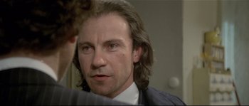 Movie still from “Bad Timing: A Sensual Obsession” (1980), directed by Nicolas Roeg – A person with long hair; Close Up shot, Over the shoulder angle