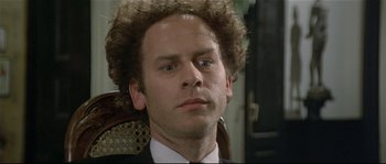 Movie still from “Bad Timing: A Sensual Obsession” (1980), directed by Nicolas Roeg – A person wearing a suit and tie; Close Up shot, Low angle