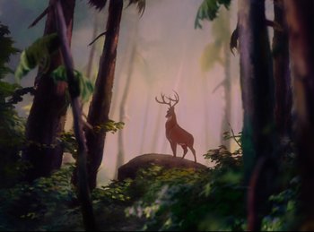 Movie still from “Bambi” (1942), directed by David Hand – A deer standing on top of a rock in the woods; Extreme Wide shot, Low angle
