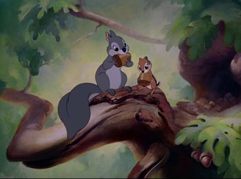 Movie still from “Bambi” (1942), directed by David Hand – A couple of animals sitting on top of a tree branch; Wide shot, High angle