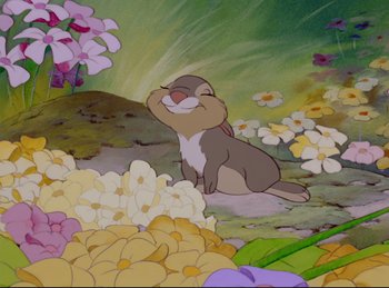 Movie still from “Bambi” (1942), directed by David Hand – A painting of a squirrel sitting in a field of flowers; Medium shot, Low angle