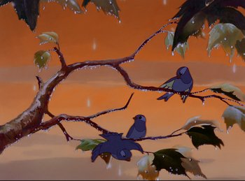Movie still from “Bambi” (1942), directed by David Hand – Two birds sitting on a branch of a tree in front of an orange sky; Wide shot, Low angle