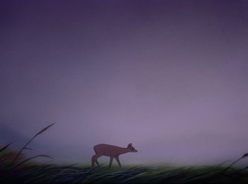 Movie still from “Bambi” (1942), directed by David Hand – A deer standing in the grass in the fog; Wide shot, Low angle