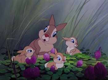 Movie still from “Bambi” (1942), directed by David Hand – A group of rabbits sitting on top of a green plant; Medium shot, High angle