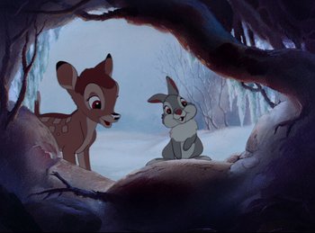 Movie still from “Bambi” (1942), directed by David Hand – A couple of animals are standing in a cave; Wide shot, High angle