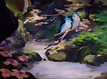 Movie still from “Bambi” (1942), directed by David Hand – Two birds sitting on a branch near a stream; Wide shot, High angle