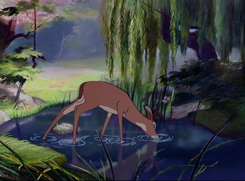 Movie still from “Bambi” (1942), directed by David Hand – A painting of a deer drinking water in a pond; Wide shot, High angle