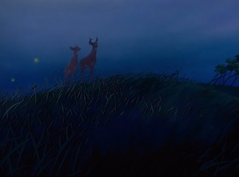 Movie still from “Bambi” (1942), directed by David Hand – A couple of deer standing on top of a grass covered hill; Extreme Wide shot, Low angle